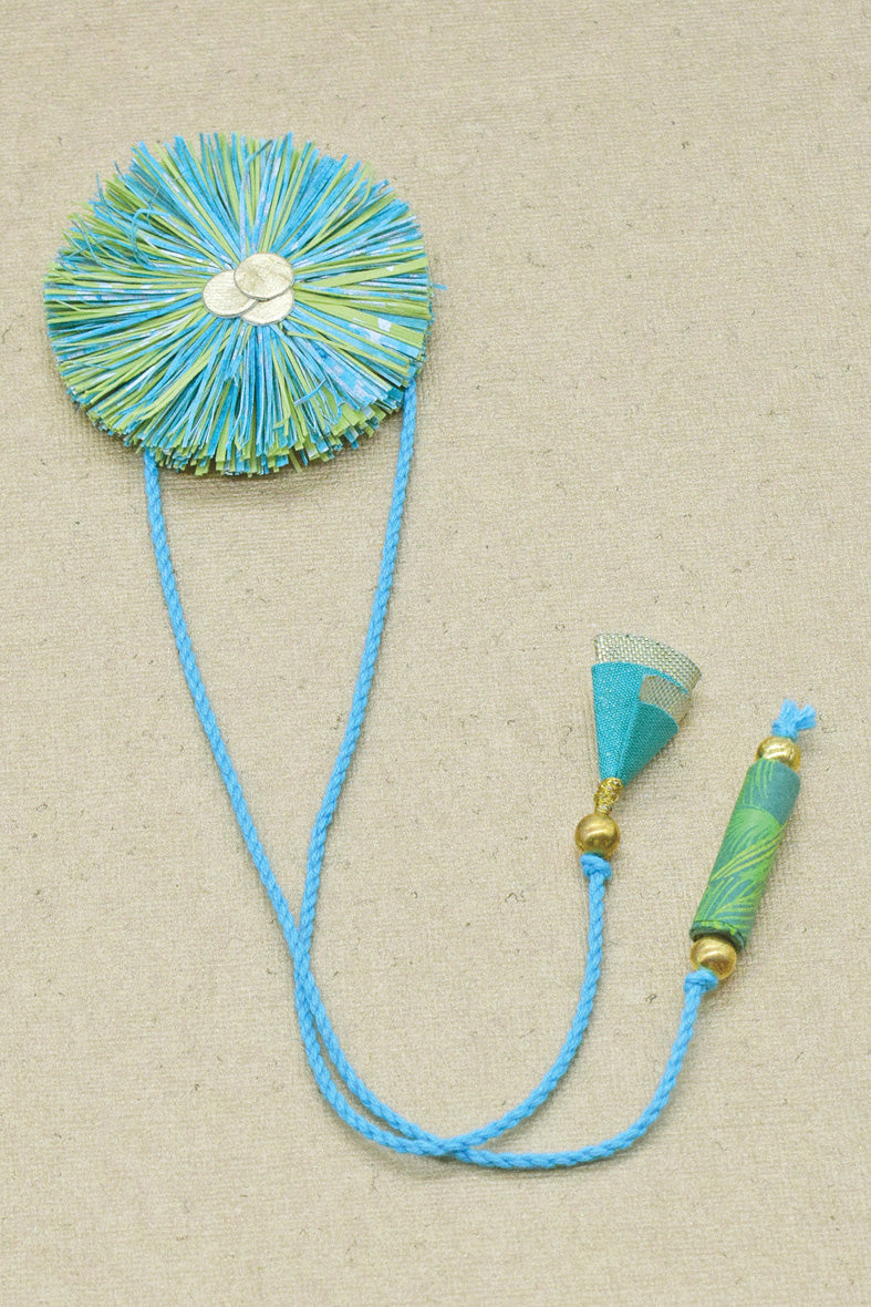 Paper Shred Unicolour Rakhi with Paper Tassels