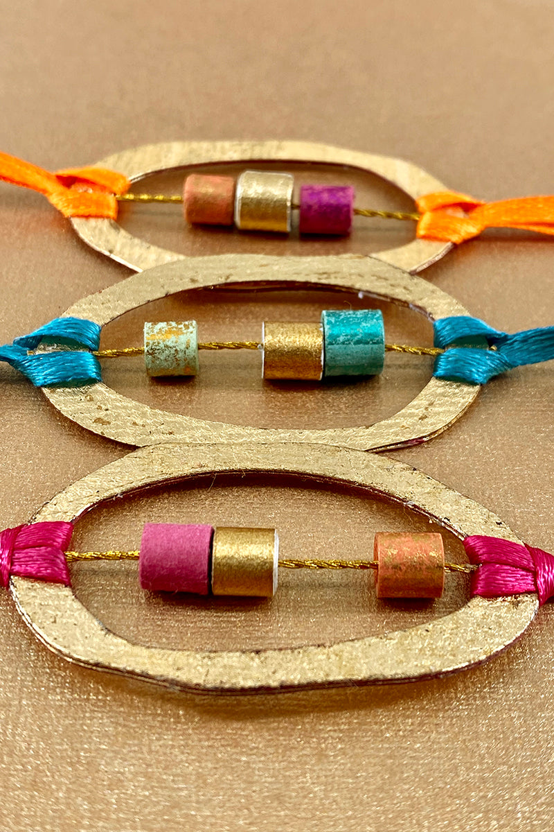 Gold Leaf With Beads and Tassels Handmade Paper Rakhi Online