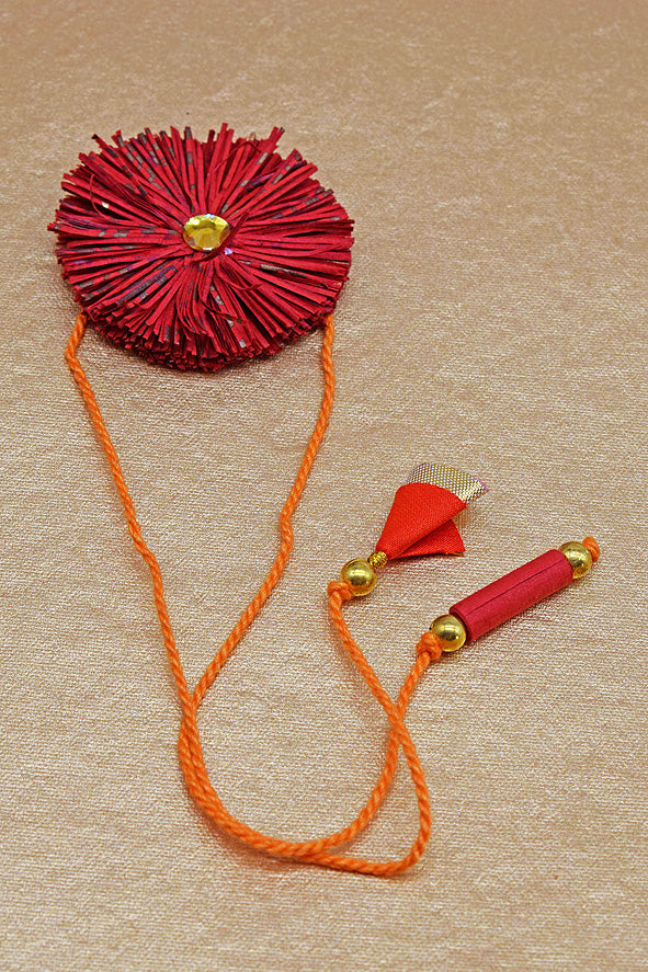 Paper Shred Unicolour Rakhi with Paper Tassels