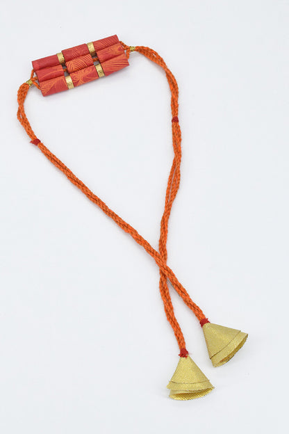 Trimmed paper bead rakhi with tassel