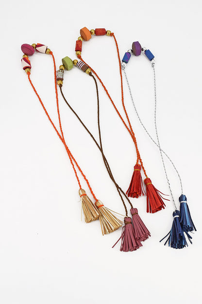 Trimmed paper bead rakhi with tassel