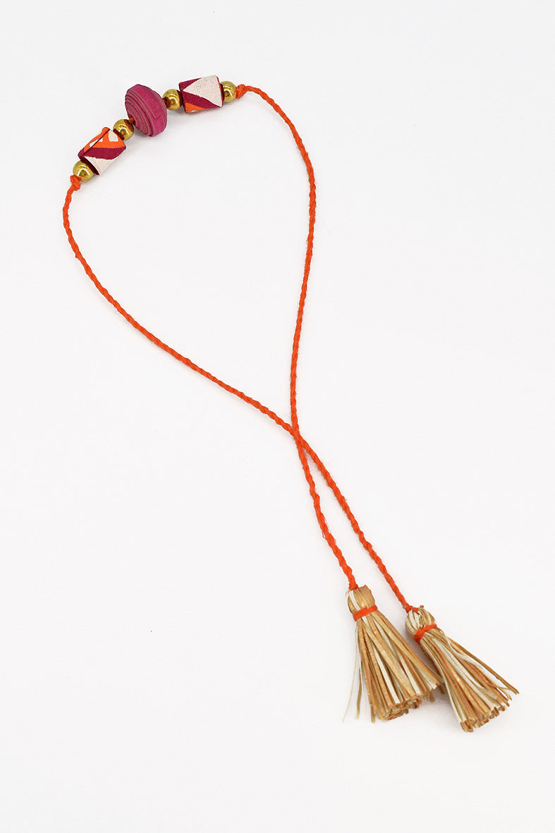 Trimmed paper bead rakhi with tassel